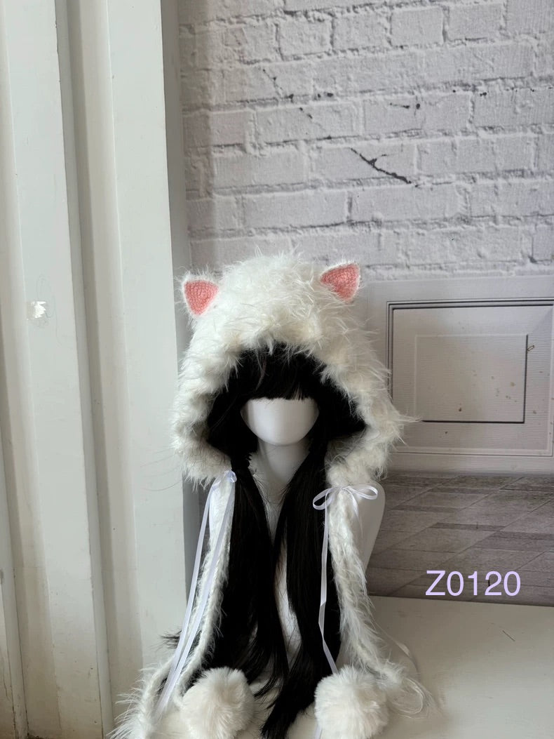 handmade crochet coquette dollette cat ear hood in fluffy white texture with pink inner ears, white satin ribbon bows and soft pompom ends. Sweet fairycore headwear for cosplay, photoshoot prop and gift idea