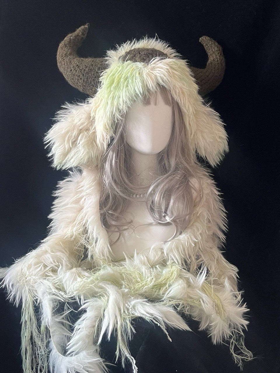 handmade crochet cottagecore goat horn hood in cream and pale green shaggy texture with brown curved horns, woodland cosplay hat