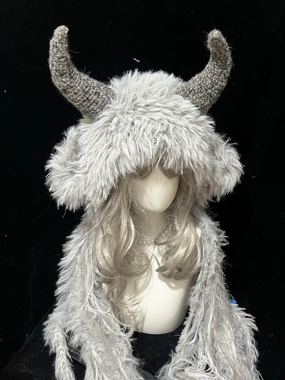 handmade crochet dark fairycore goat horn hood in gray and white shaggy texture with curved gray horns, fantasy festival headwear