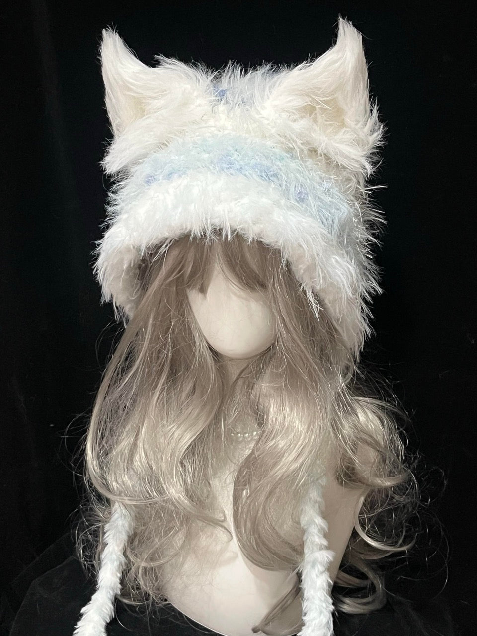 handmade crochet fairycore fox ear hat in white and pale blue shaggy texture with long braided ties, whimsical winter headwear