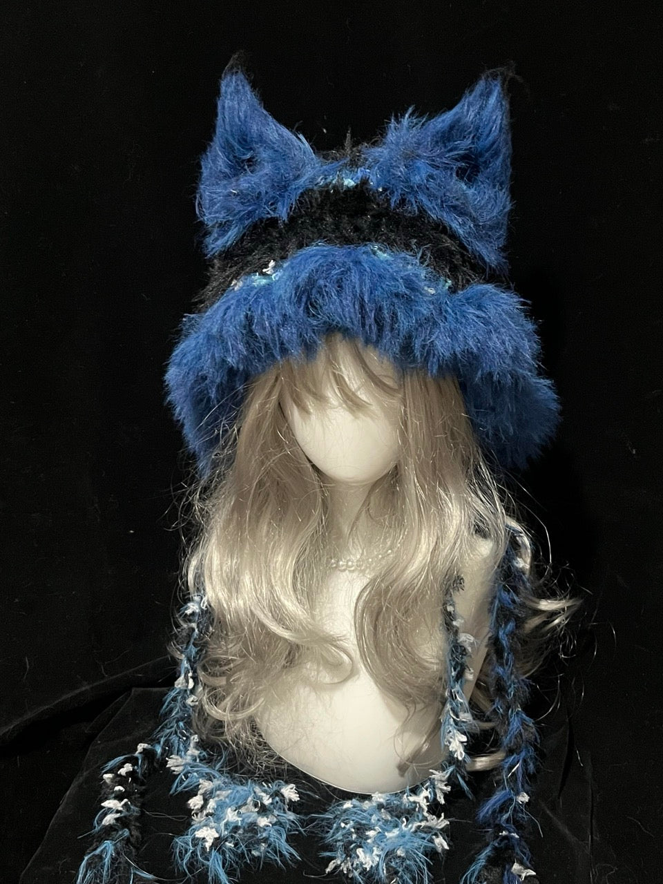 handmade crochet gothic fox ear hat in black and blue shaggy texture with floral speckles and long tassels, dark fantasy winter accessory