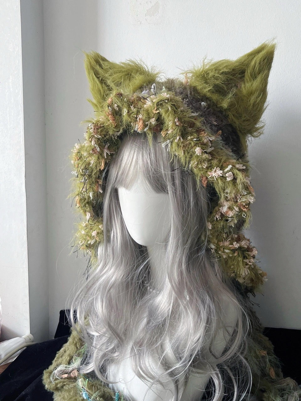 handmade crochet goblincore fox ear hat in olive green floral shaggy texture with long braided ties, forest cosplay accessory