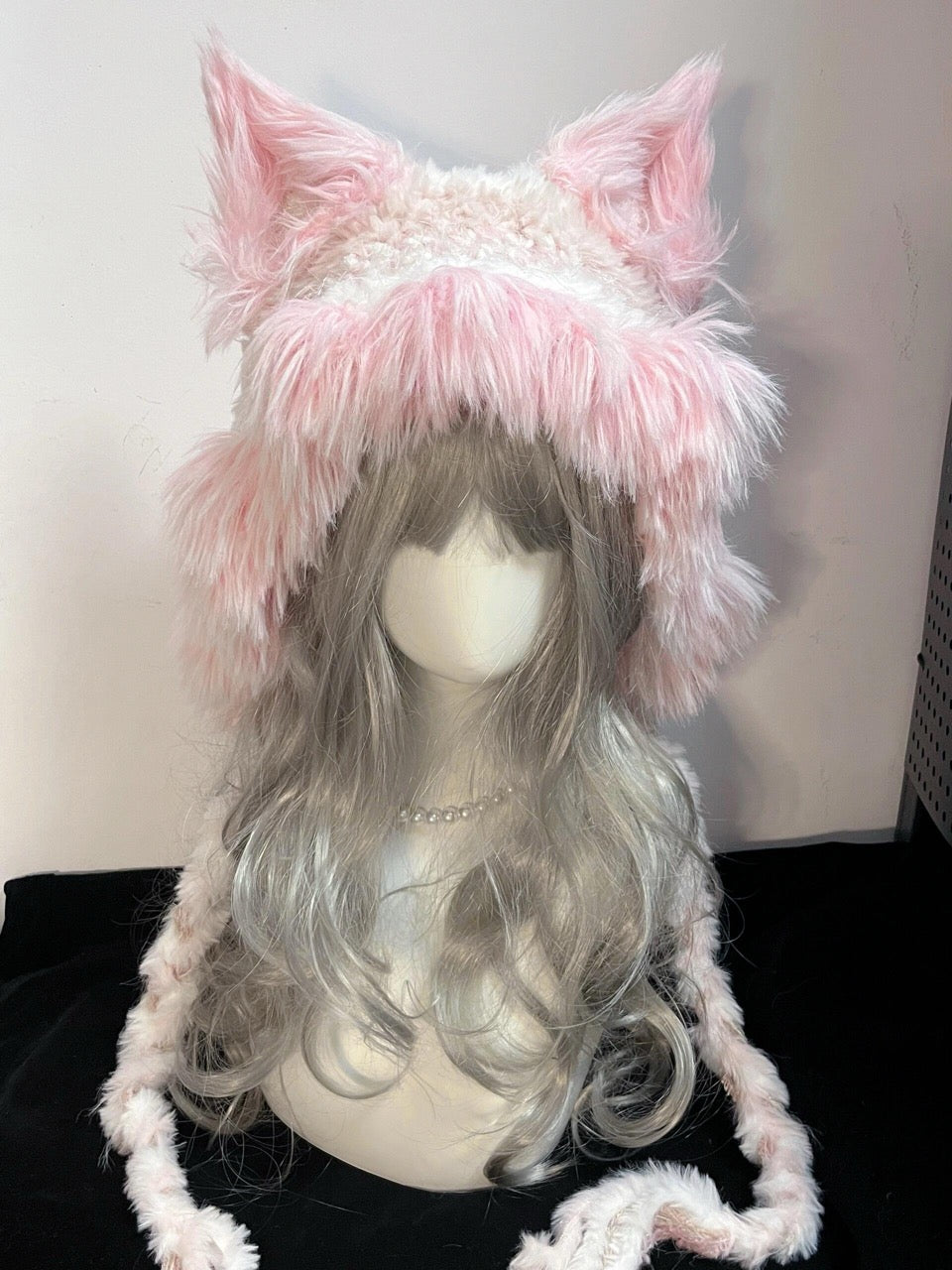 handmade crochet coquette fox ear hat in pink and white shaggy texture with long braided ties, kawaii winter headwear