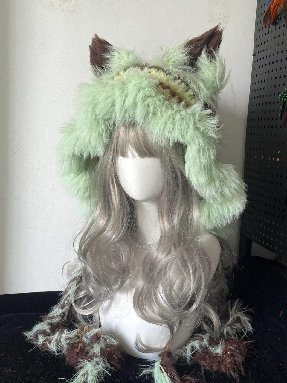 handmade crochet goblincore fox ear hat in mint green and brown shaggy texture with long braided ties, woodland festival accessory