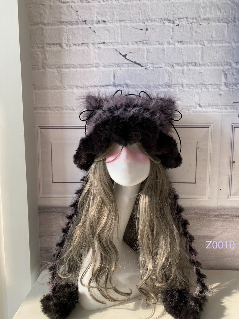handmade crochet goth dark fairy cat ear hat in black and purple mixed fluffy texture with pointed ears and long trailing ties. Whimsical cosplay headwear for rave party and winter photoshoots