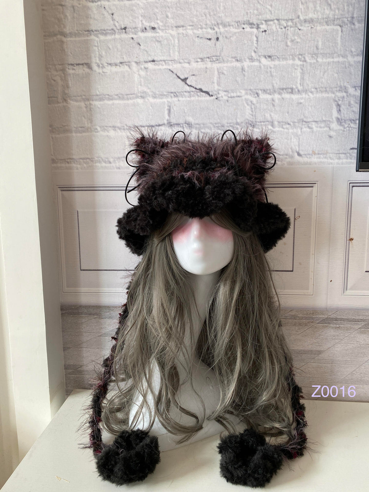 handmade crochet goblincore woodland cat ear hat in dark green floral fluffy texture with pointed ears and plush pompom ties. Cottagecore headwear for cosplay, festival and photoshoot styling