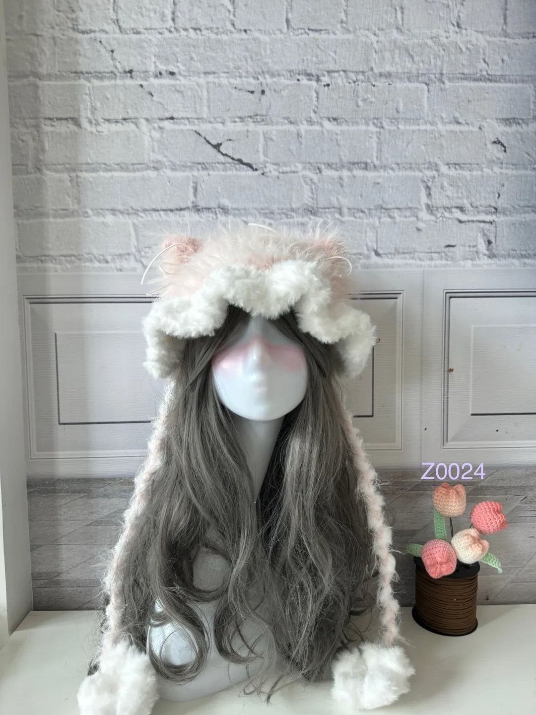 handmade crochet coquette fairycore cat ear hat in cream and pale pink floral fluffy texture with pointed ears and soft pompom ties. Sweet winter headwear for cosplay, photoshoot prop and romantic gift giving