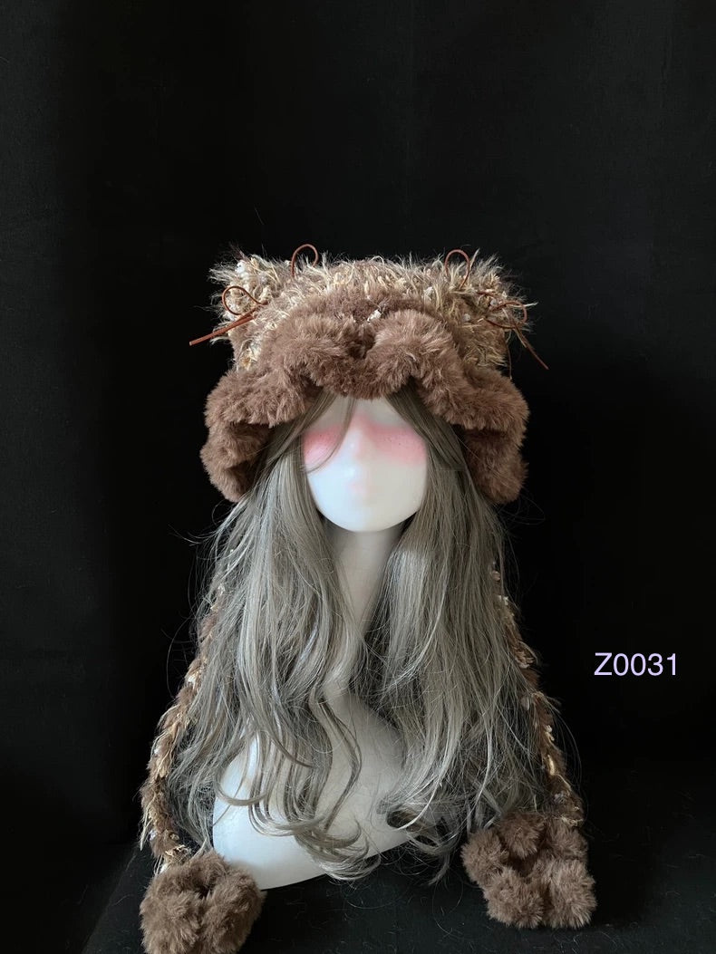 handmade crochet woodland cottagecore cat ear hat in brown and camel mixed fluffy texture with pointed ears and plush pompom ties. Mori girl style winter headwear for cosplay, festival and photoshoot styling