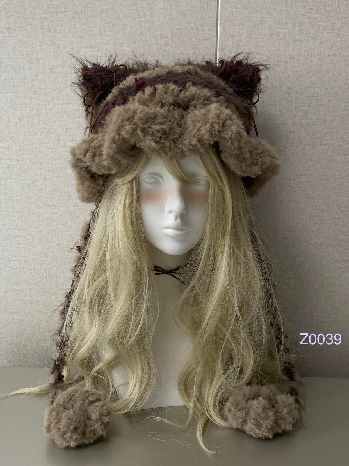 handmade crochet woodland goblincore cat ear hat in brown and purple floral fluffy texture with pointed ears and plush pompom ties. Cottagecore headwear for cosplay, festival and photoshoot styling