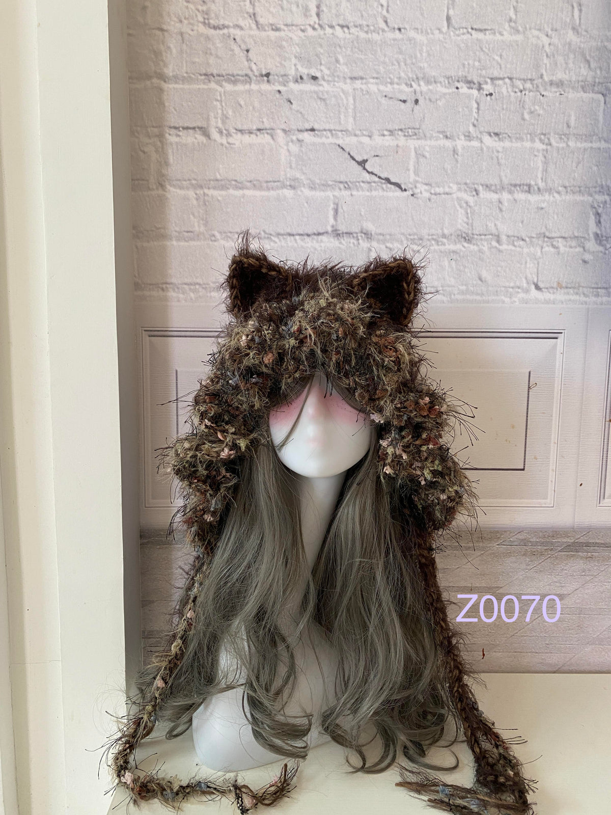 handmade crochet goblincore woodland cat ear hood in dark brown and moss textured yarn with earthy floral accents and long trailing strands. Cottagecore headwear for cosplay, music festival and photoshoots
