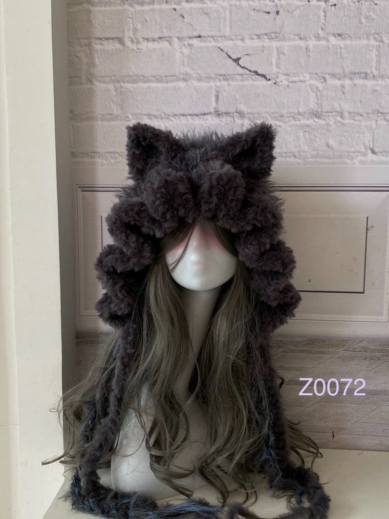 handmade crochet goth dark fairy cat ear hood in dark purple and blue fluffy contrast with pointed ears and long trailing ties. Whimsical cosplay headwear for rave party and winter photoshoots