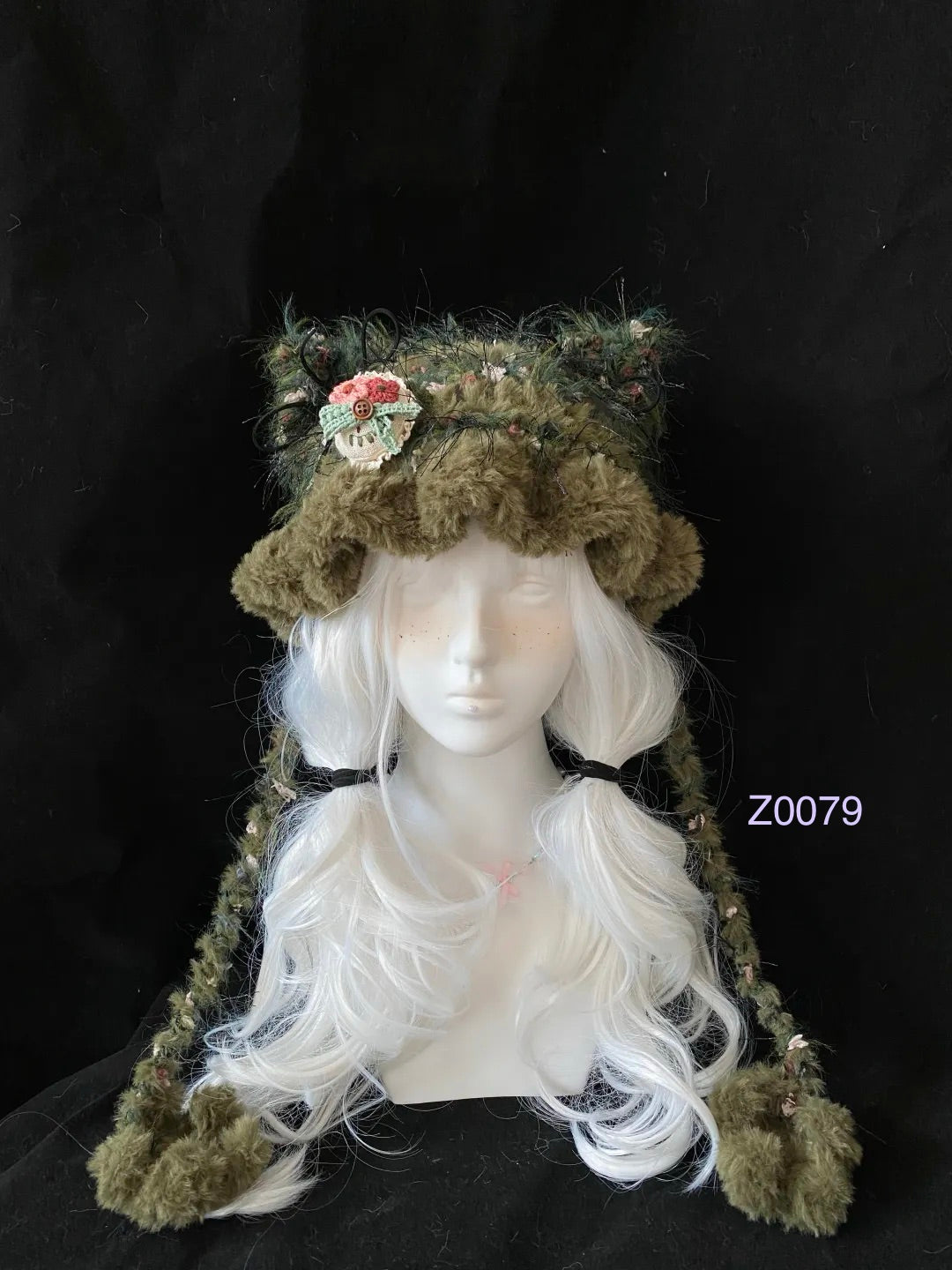 handmade crochet goblincore woodland cat ear hat in dark green floral fluffy texture with crochet flower accent and plush pompom ties. Cottagecore headwear for cosplay, festival and photoshoot styling