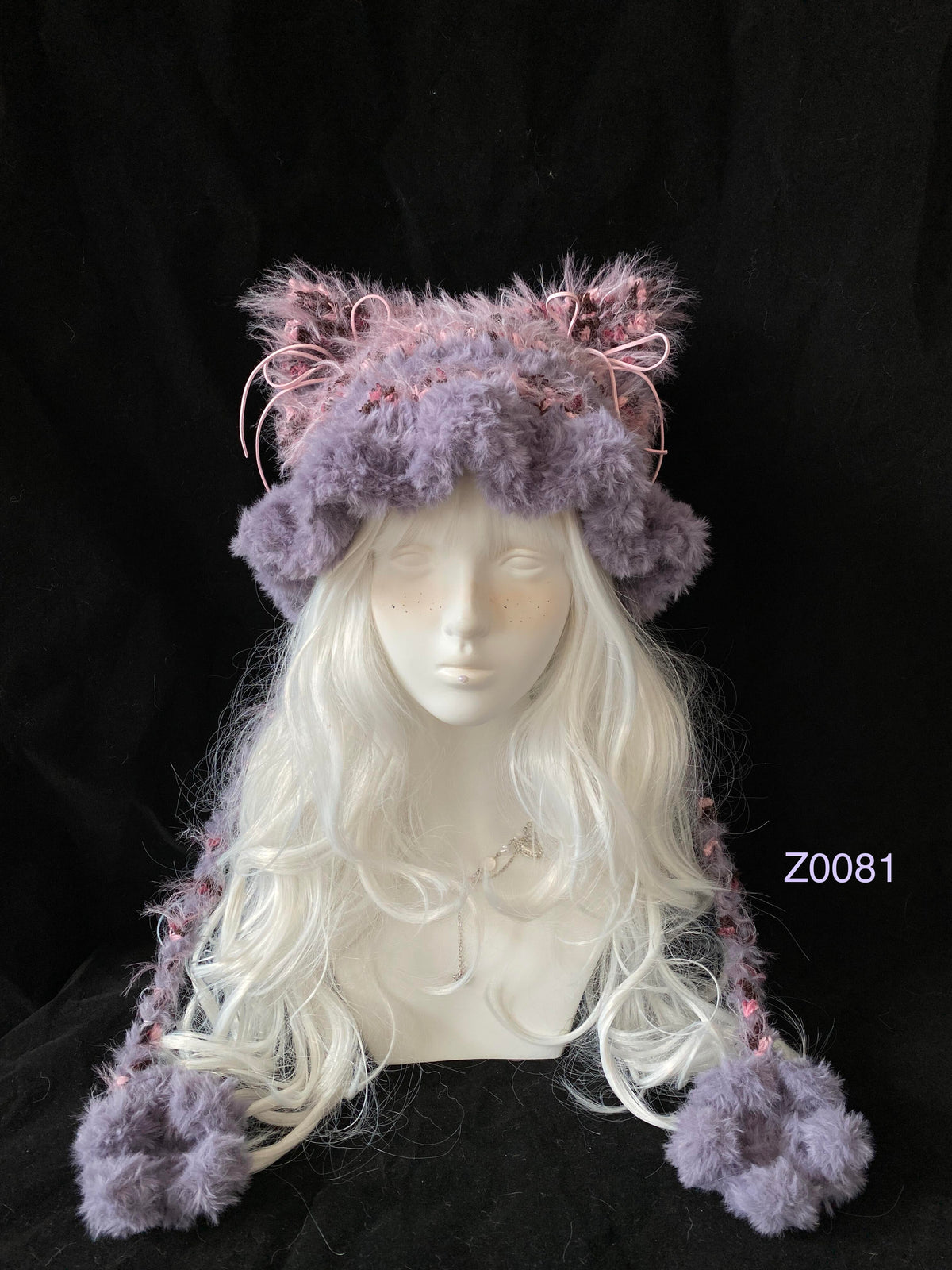 handmade crochet fairycore dollette cat ear hat in purple and pink fluffy contrast with pink ribbon details and plush pompom ties. Sweet winter headwear for cosplay, photoshoot prop and romantic gift giving