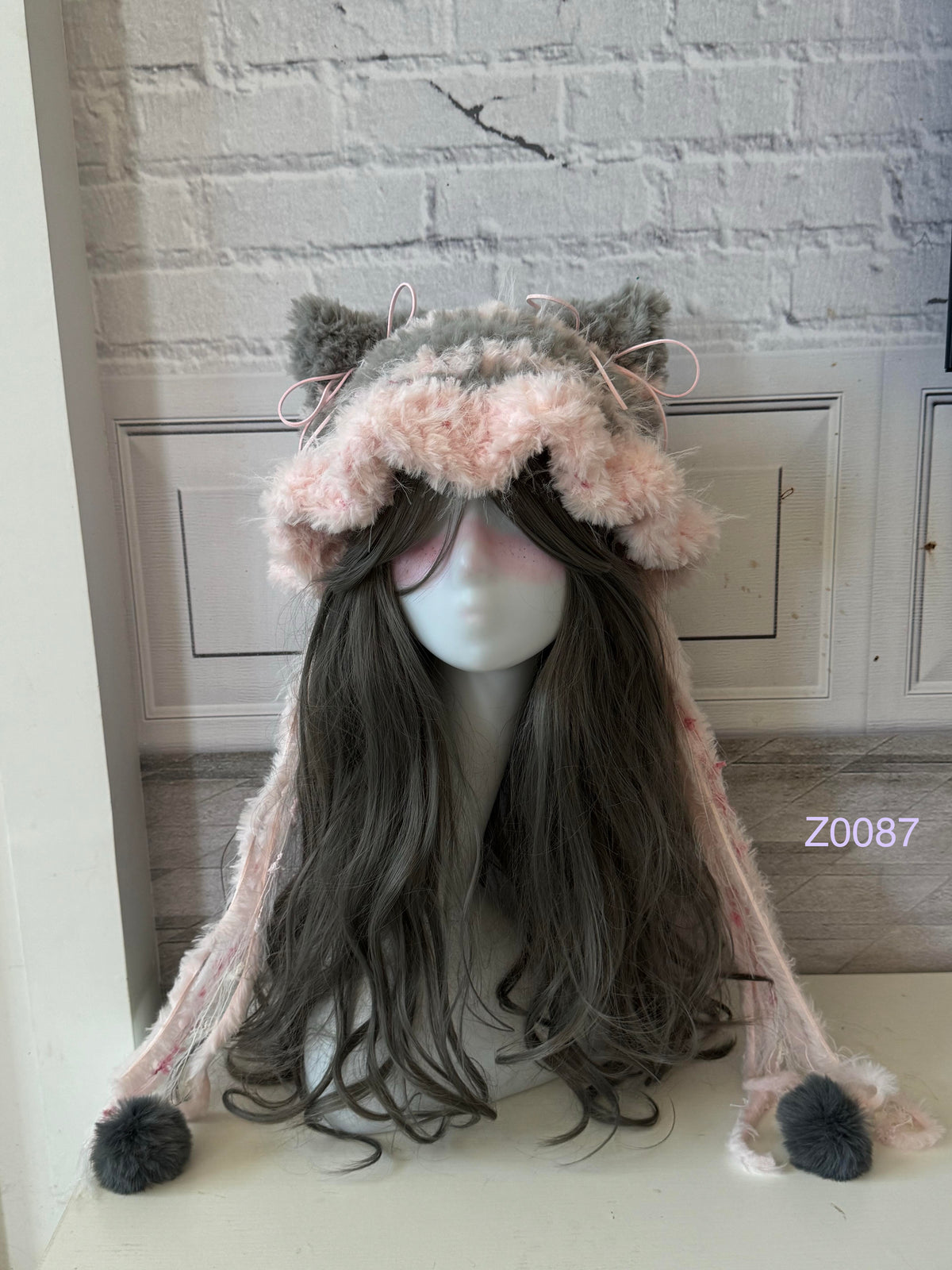 handmade crochet coquette fairycore cat ear hat in gray and pink floral fluffy texture with pointed ears and gray pompom ties. Kawaii winter headwear for cosplay, photoshoot prop and gift idea