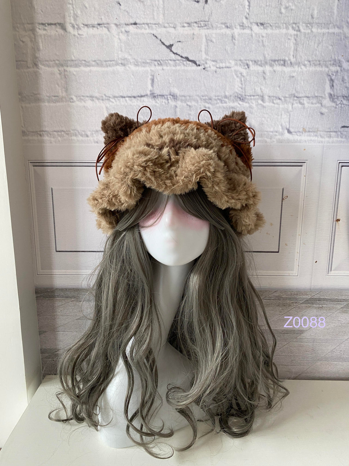 handmade crochet cottagecore coquette cat ear hat in light camel fluffy texture with pointed ears and plush pompom ties. Cozy winter headwear for cosplay, photoshoot prop and gift idea