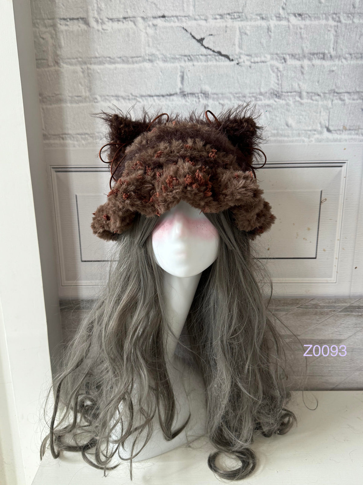 handmade crochet woodland cottagecore cat ear hat in dark brown floral fluffy texture with pointed ears and brown satin ribbon ties. Mori girl style winter headwear for cosplay, festival and photoshoot styling