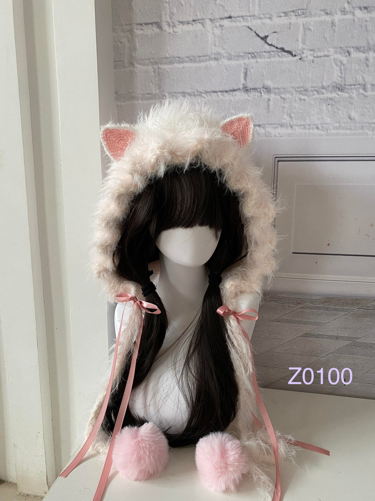 handmade crochet coquette kawaii cat ear hood in fluffy white with soft pink inner ears, pink satin ribbon bows and pink pompom ties. Sweet fairycore headwear for cosplay, photoshoot prop and gift idea