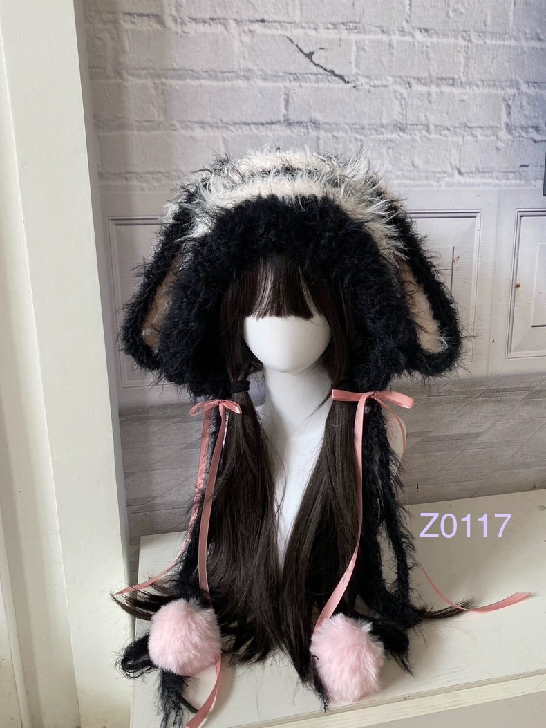 handmade crochet goth coquette bunny ear hood with dramatic black and pink fluffy contrast, pink satin ribbons and soft pink pompom ends. Kawaii cosplay headwear for rave party and photoshoot styling