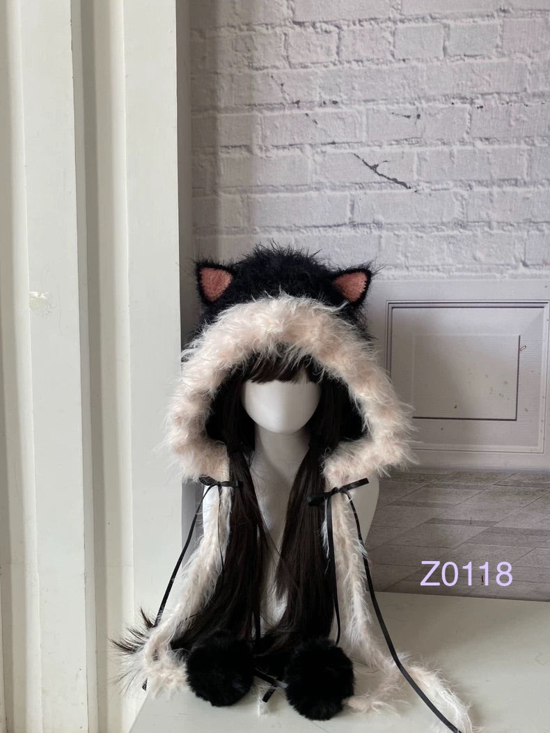 handmade crochet goth coquette cat ear hood with dramatic black and pale pink fluffy contrast, pink inner ears, black satin ribbons and fur pompom ties. Kawaii cosplay headwear for rave party and photoshoot styling
