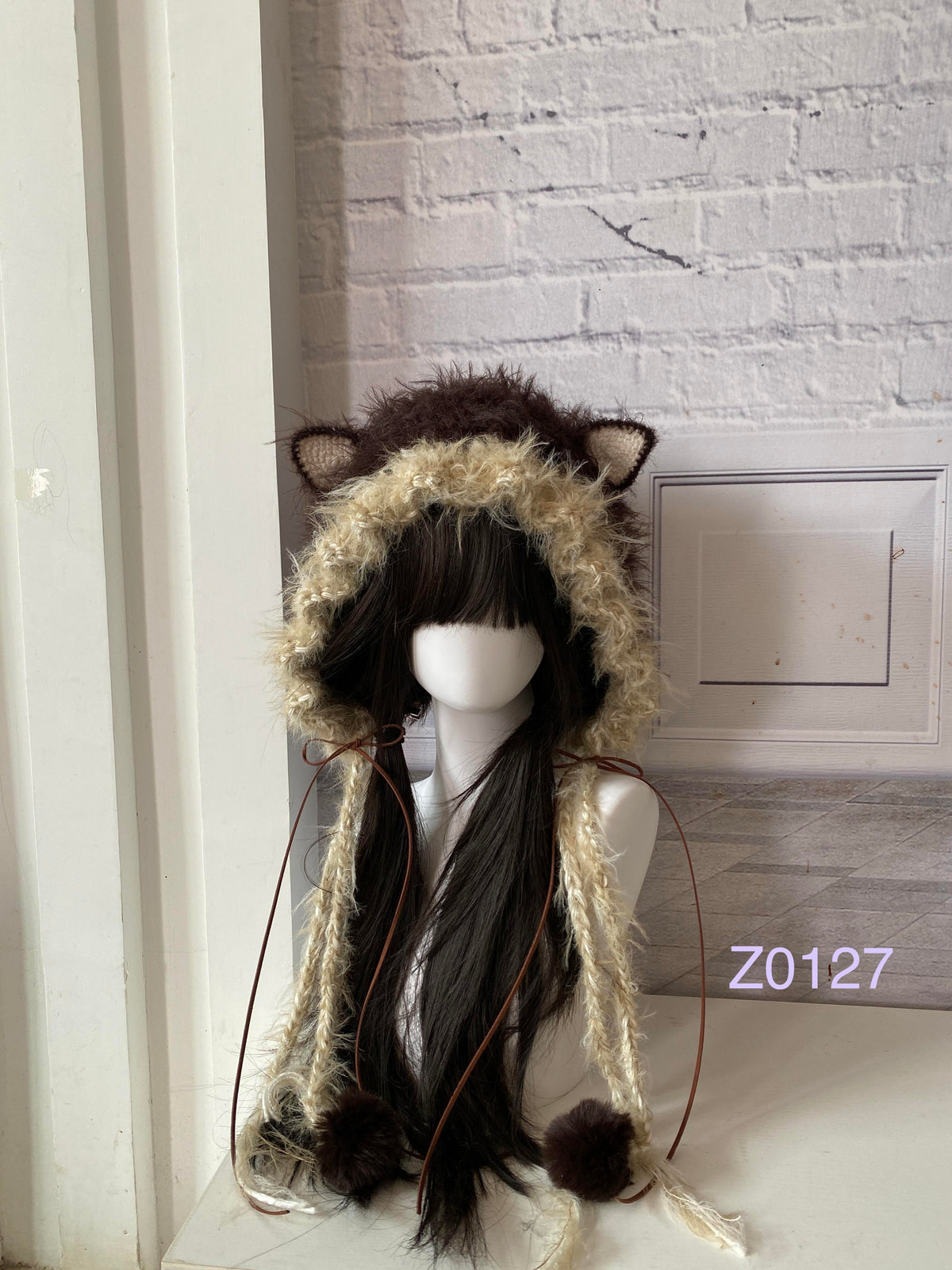 handmade crochet woodland cottagecore cat ear hood in dark brown and cream fluffy contrast, brown satin ribbons and fur pompom ties. Mori girl style headwear for cosplay, winter festival and photoshoots