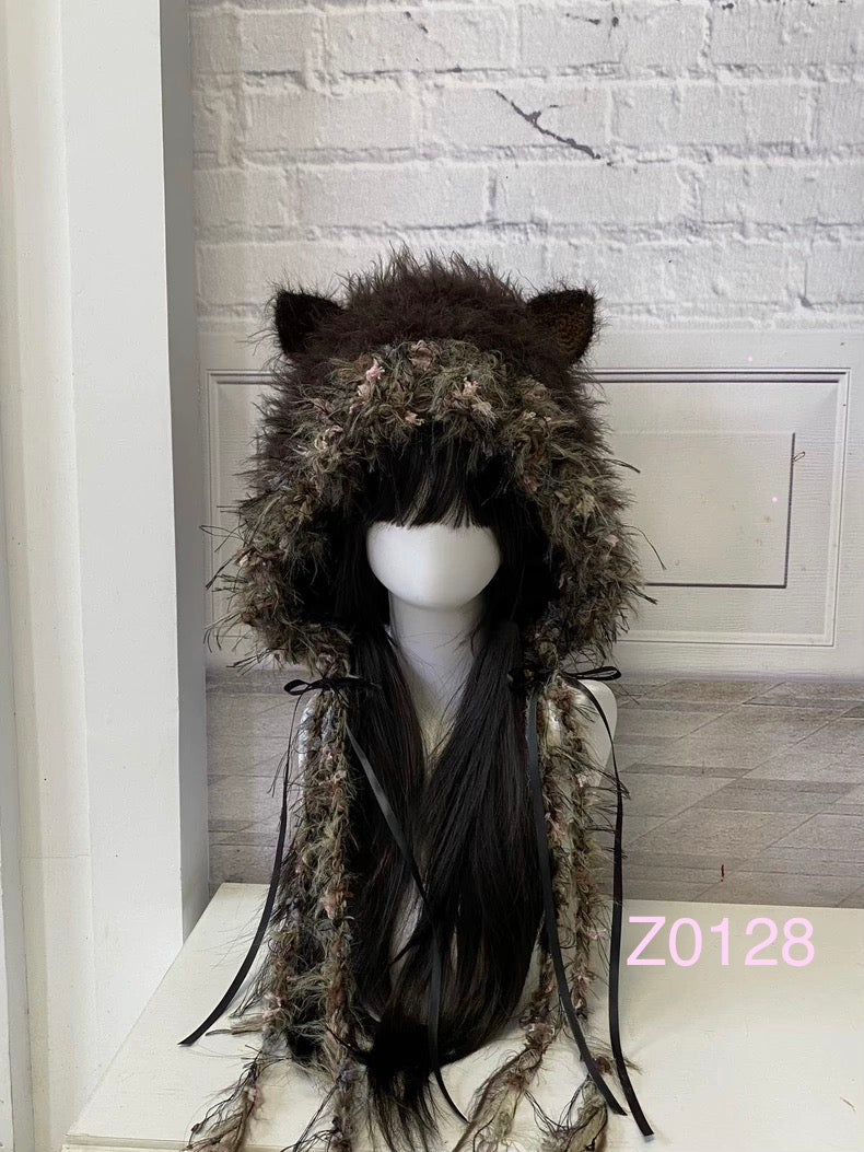 handmade crochet woodland mori girl cat ear hood in dark brown and light brown floral textured yarn with black satin ribbon ties and long trailing strands. Cottagecore headwear for cosplay, festival and photoshoot styling