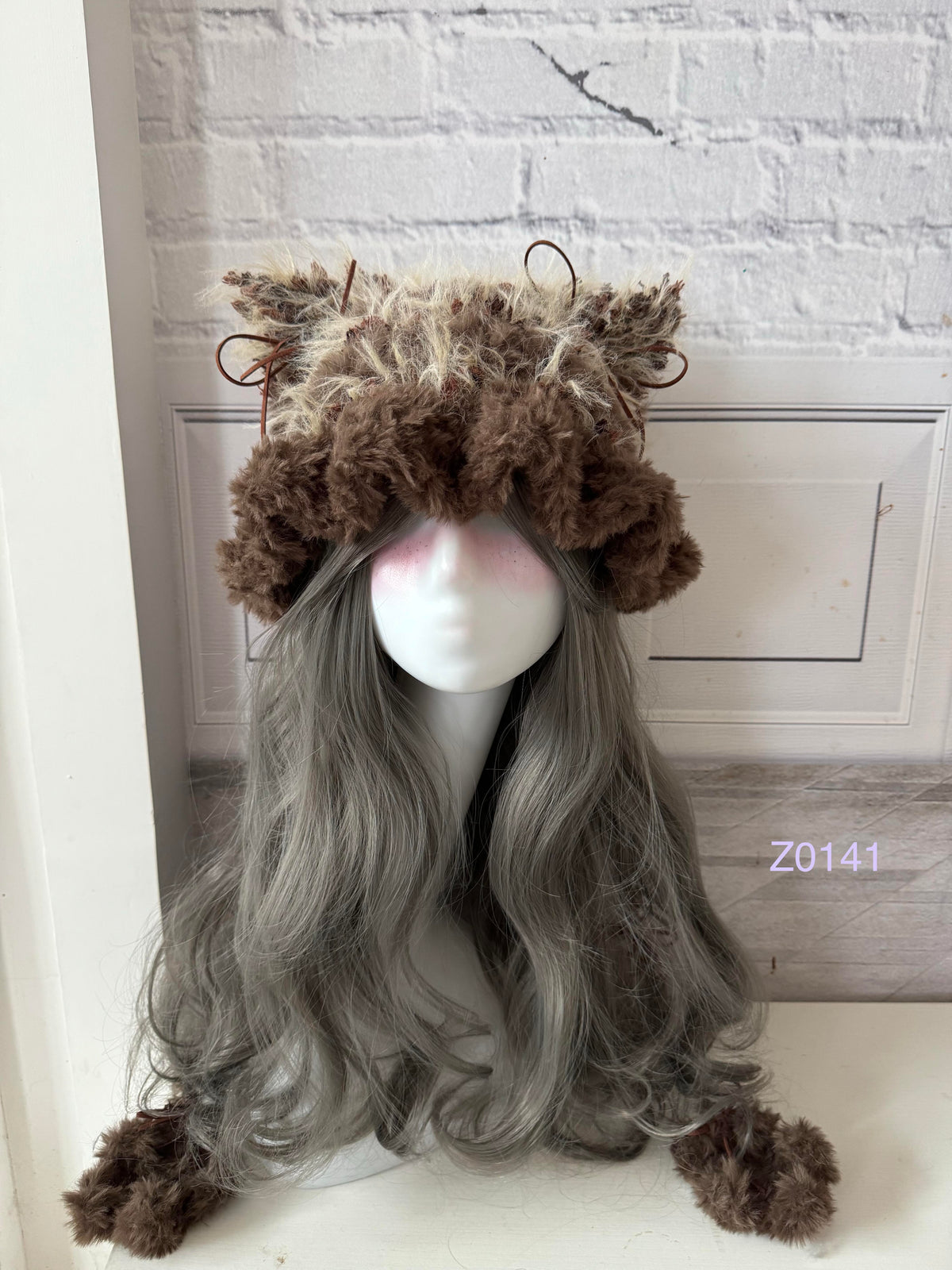 handmade crochet woodland cottagecore cat ear hat in dark brown and camel fluffy contrast with pointed ears and plush pompom ties. Mori girl style winter headwear for cosplay, festival and photoshoot styling