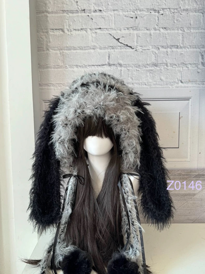 handmade crochet goth monochrome bunny ear hood with black and gray gradient fluffy texture, black satin ribbons and fur pompom ends. Dark fairy headwear for cosplay, rave party and winter photoshoots