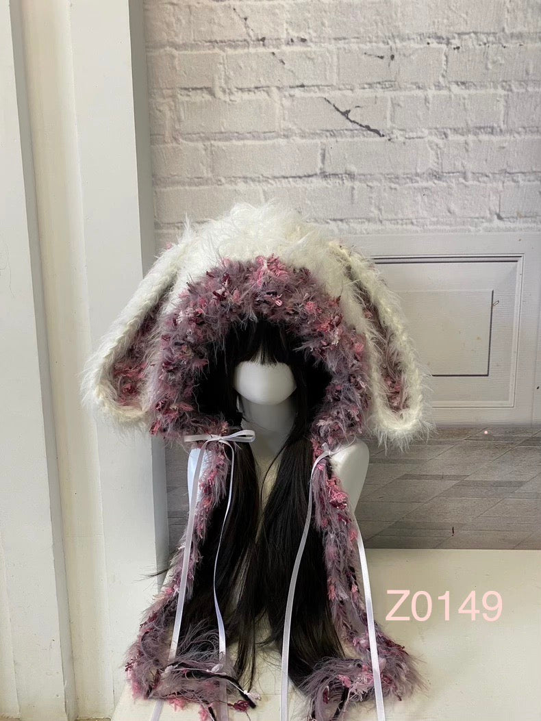 handmade crochet dark fairy coquette bunny ear hood in white and purple pink floral textured yarn with white satin ribbons and long trailing details. Whimsical headwear for cosplay, party and photoshoot styling