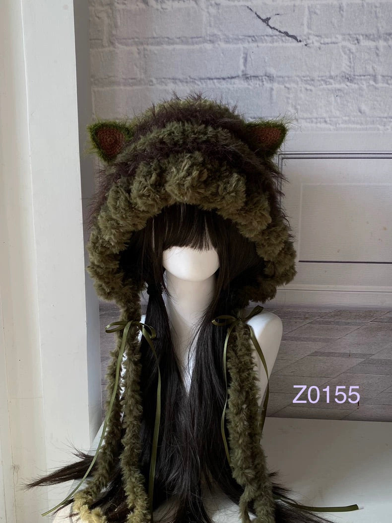 handmade crochet goblincore woodland cat ear hood in olive green fluffy texture with pointed ears, olive satin ribbons and long trailing ties. Cottagecore headwear for cosplay, music festival and photoshoot styling