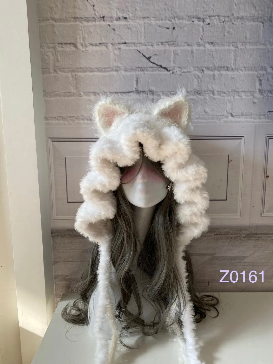 handmade crochet coquette fairycore cat ear hood in fluffy white texture with pink inner ears and long trailing ties. Sweet winter headwear for cosplay, photoshoot prop and romantic gift giving