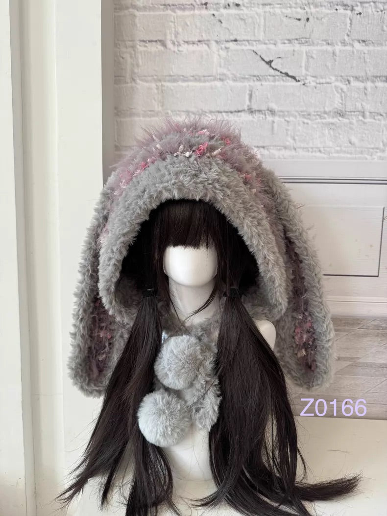 handmade crochet fairycore coquette bunny ear hood in gray and pink floral textured yarn with long floppy ears and plush pompom ties. Kawaii winter headwear for cosplay, photoshoot prop and romantic gift giving