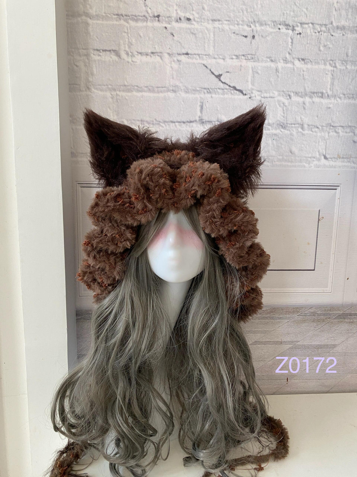 handmade crochet woodland mori girl fox ear hood in deep brown fluffy texture with pointed ears and long trailing ties. Cottagecore headwear for cosplay, winter festival and photoshoot styling