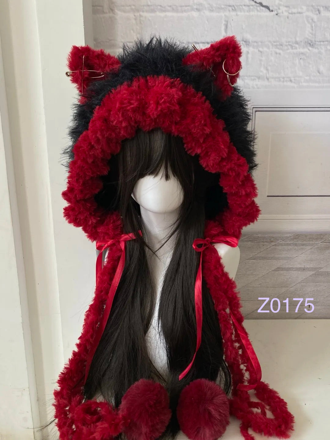 handmade crochet goth dark fairy cat ear hood with bold black and red fluffy contrast, red satin ribbon ties and fur pompom ends. Whimsical cosplay headwear for rave party and winter photoshoots