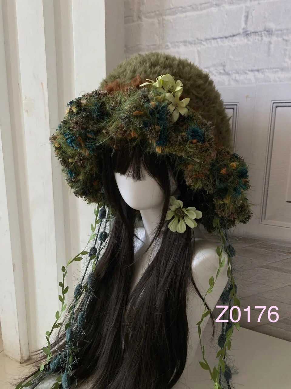 handmade crochet goblincore mushroomcore jellyfish hat in forest green moss and floral textured yarn with leafy vine ties and soft mushroom accents. Woodland cottagecore headwear for cosplay, music festival and photoshoot styling