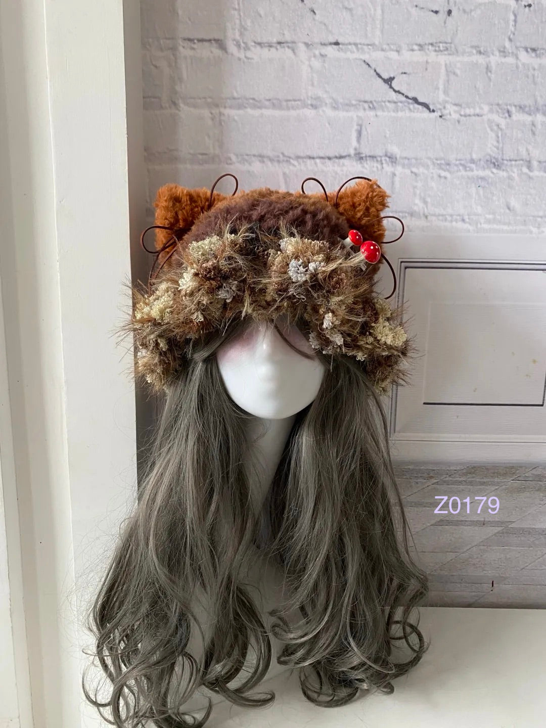 handmade crochet goblincore mushroomcore cat ear hat in brown floral fluffy texture with tiny red mushroom accents and plush pompom ties. Cottagecore headwear for cosplay, festival and photoshoot styling
