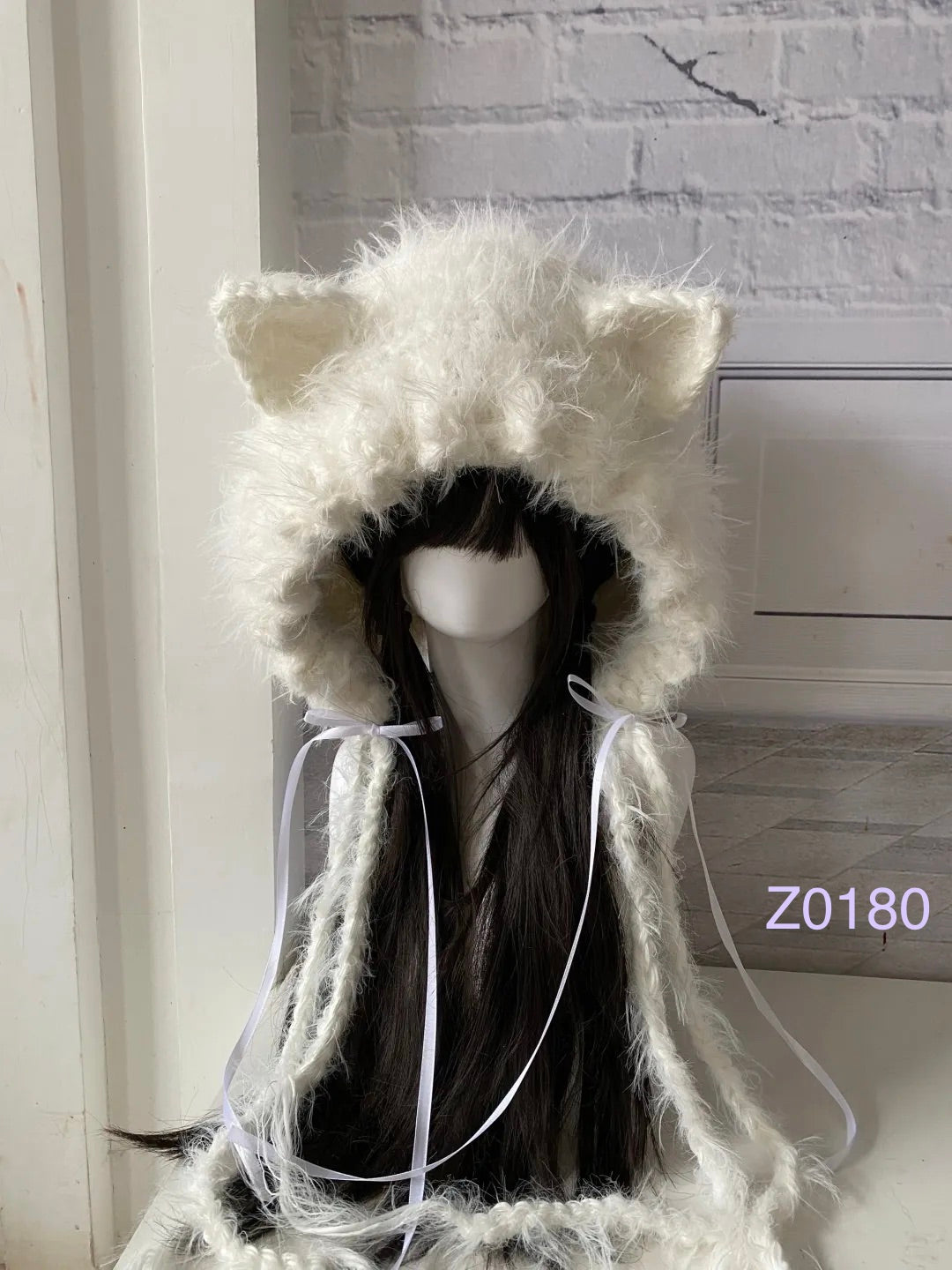 handmade crochet fairycore coquette cat ear hood in fluffy white texture with pointed ears and white satin ribbon ties. Sweet winter headwear for cosplay, photoshoot prop and romantic gift giving