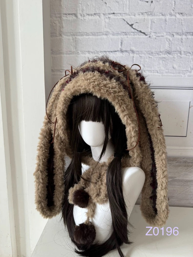 handmade crochet woodland cottagecore bunny ear hood in tan and brown fluffy contrast with long floppy ears and plush pompom ties. Mori girl style winter headwear for cosplay, festival and photoshoot styling