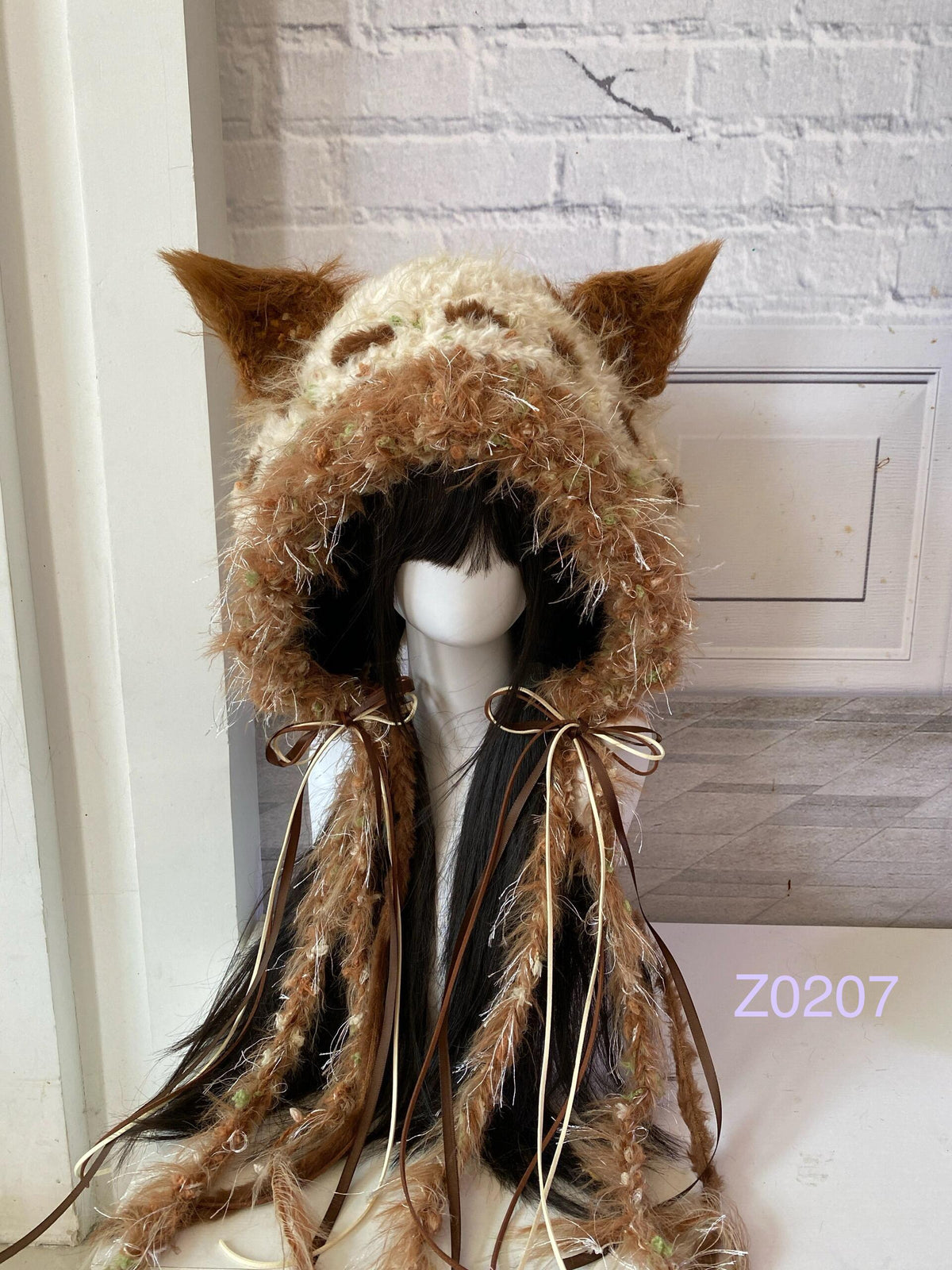 handmade crochet woodland cottagecore fox ear hood in earthy brown floral textured yarn with pointed ears and brown satin ribbon ties. Mori girl style headwear for cosplay, festival and photoshoot styling