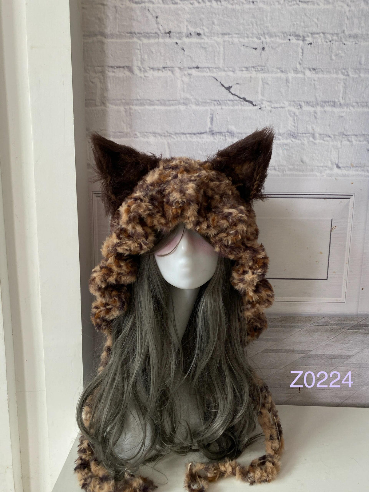 handmade crochet grunge woodland fox ear hood in brown leopard print fluffy texture with tall pointed ears and long trailing ties. Dark fairy headwear for cosplay, rave party and winter photoshoots