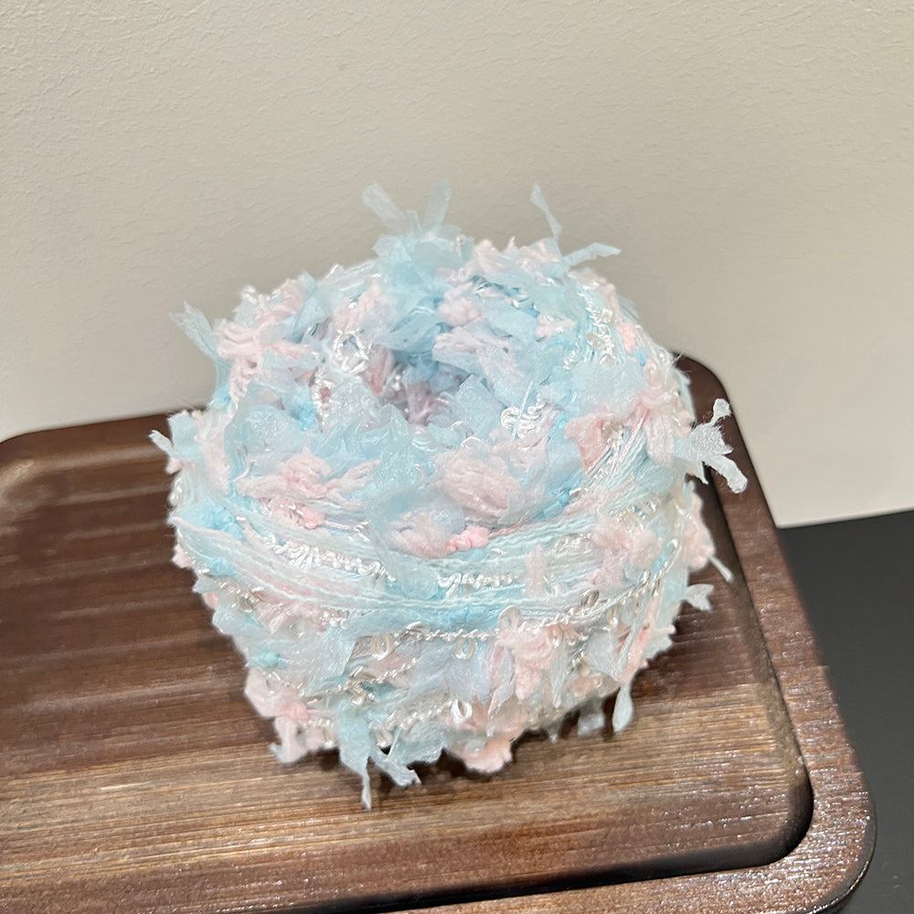 Close up sheer floral mesh fiber mixed with blue pink soft yarn texture detail