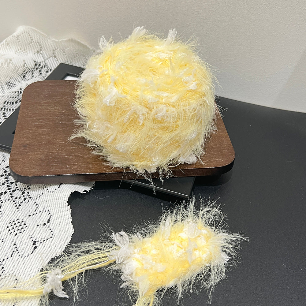 Sunny pale lemon yellow cake yarn with lace backdrop, bright pastel textured art yarn for home decor crafts