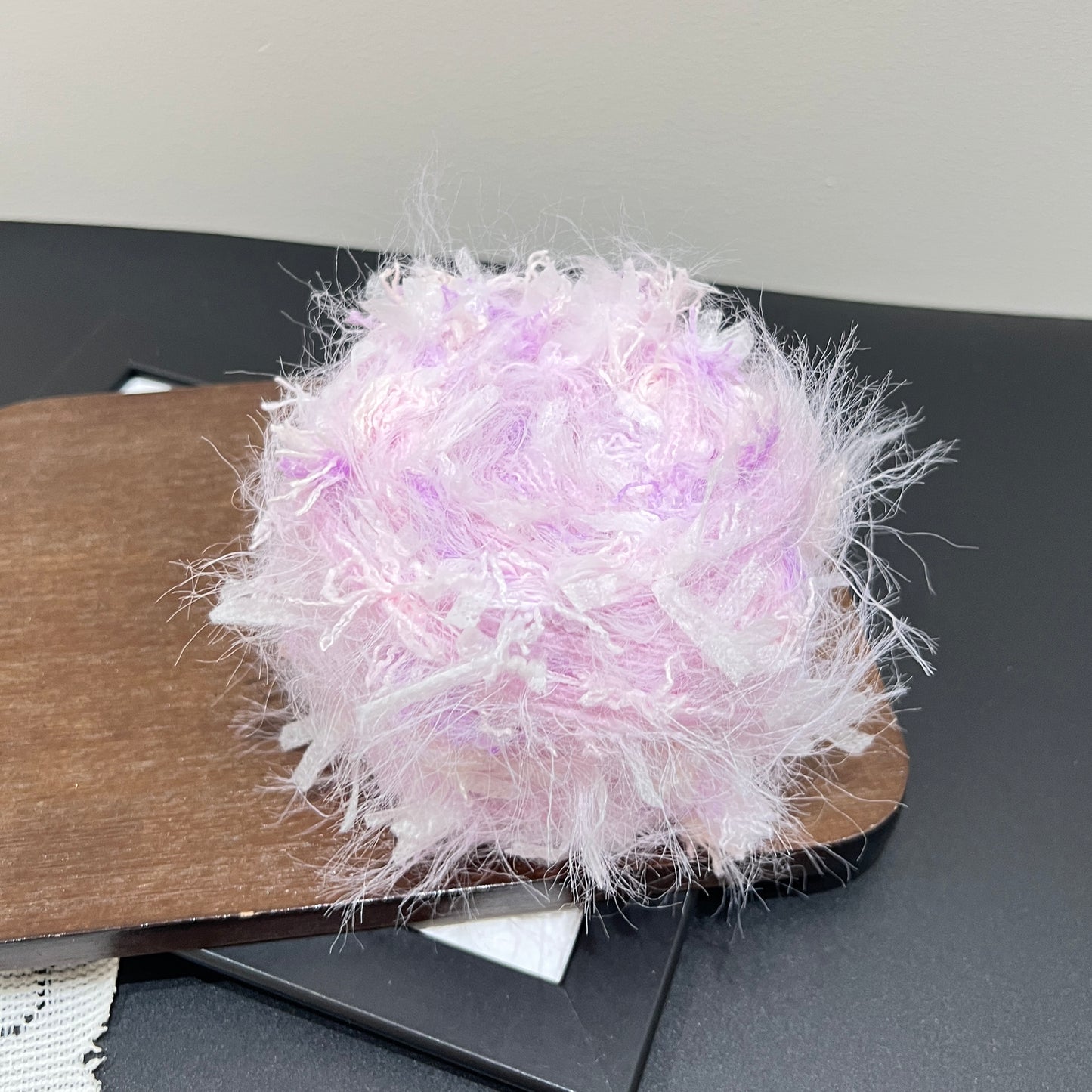 Full front round display pastel lavender iridescent mixed fiber art yarn cake