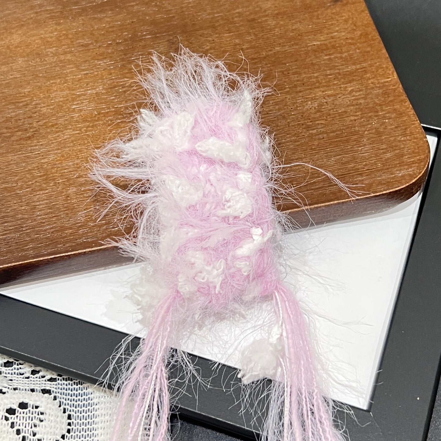 Close-up detail of pastel purple white petal layered multi-strand blended fiber texture