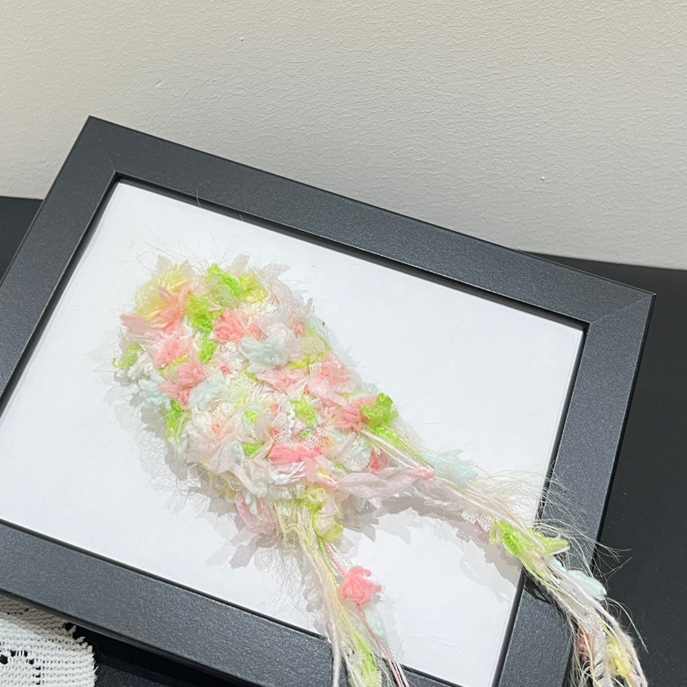 Side view pink green cream multi-tone yarn, airy soft vegan textured fiber art supply for crafters